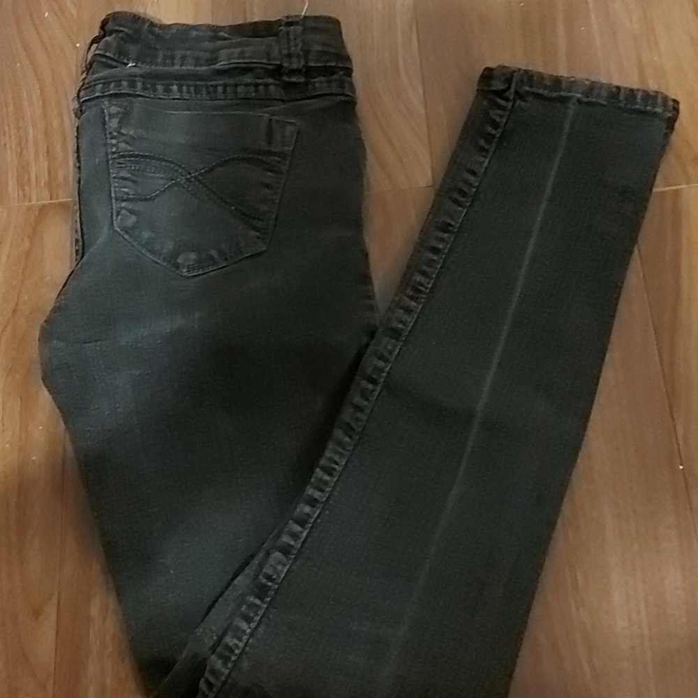 Faded black London skinny jeans.